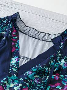 Plus Size V-Neck Shirt With Floral Print And Ruffle Hem