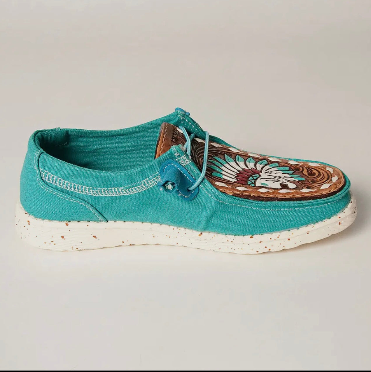 Teal slip on with tooled leather toe